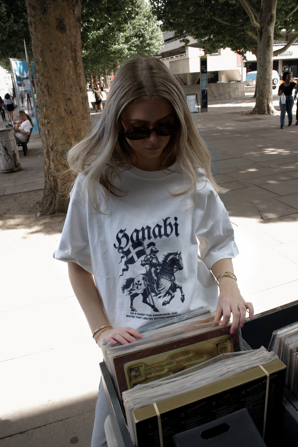 Woman wearing a Hanabi bookish graphic t-shirt