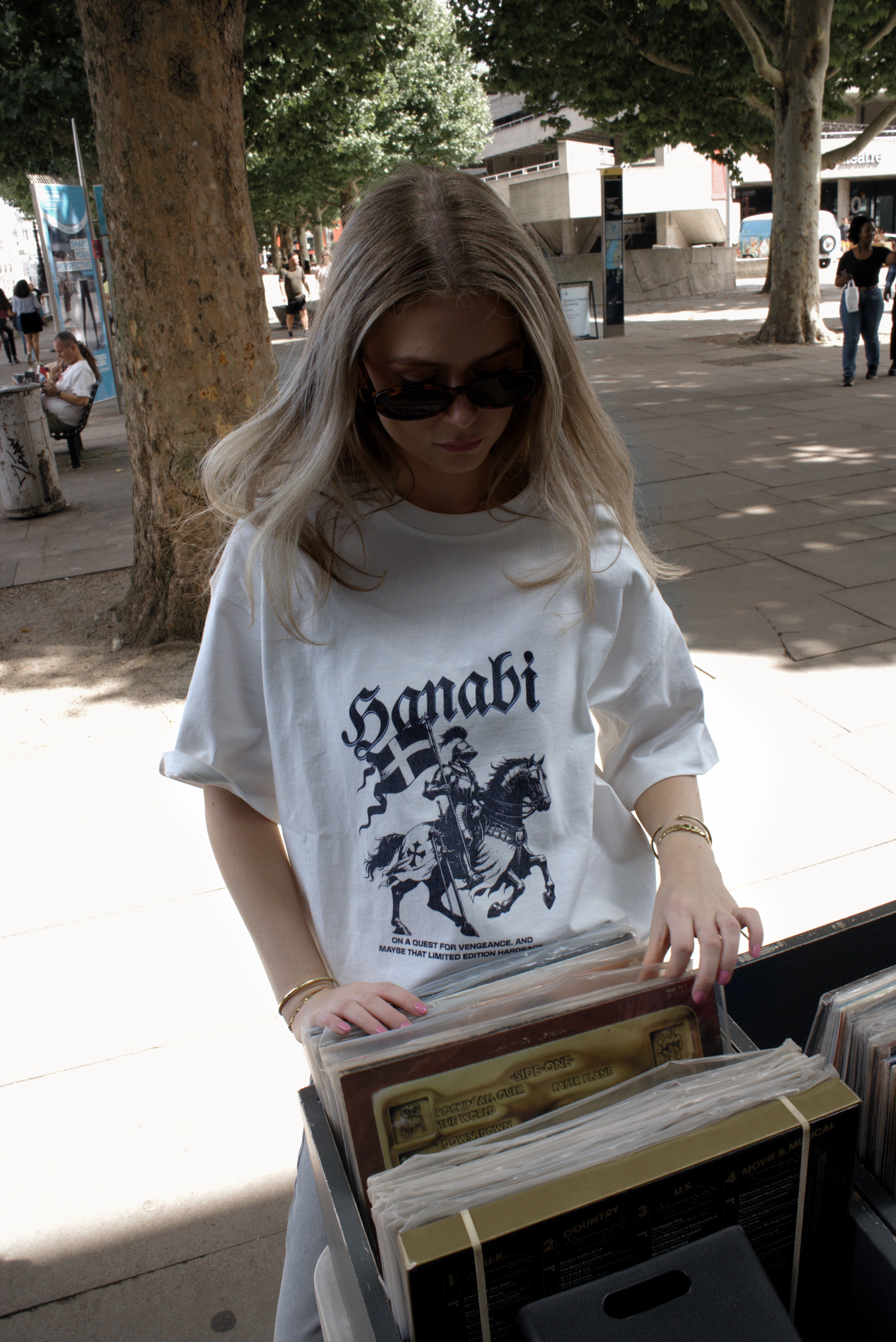 Woman wearing a Hanabi bookish graphic t-shirt