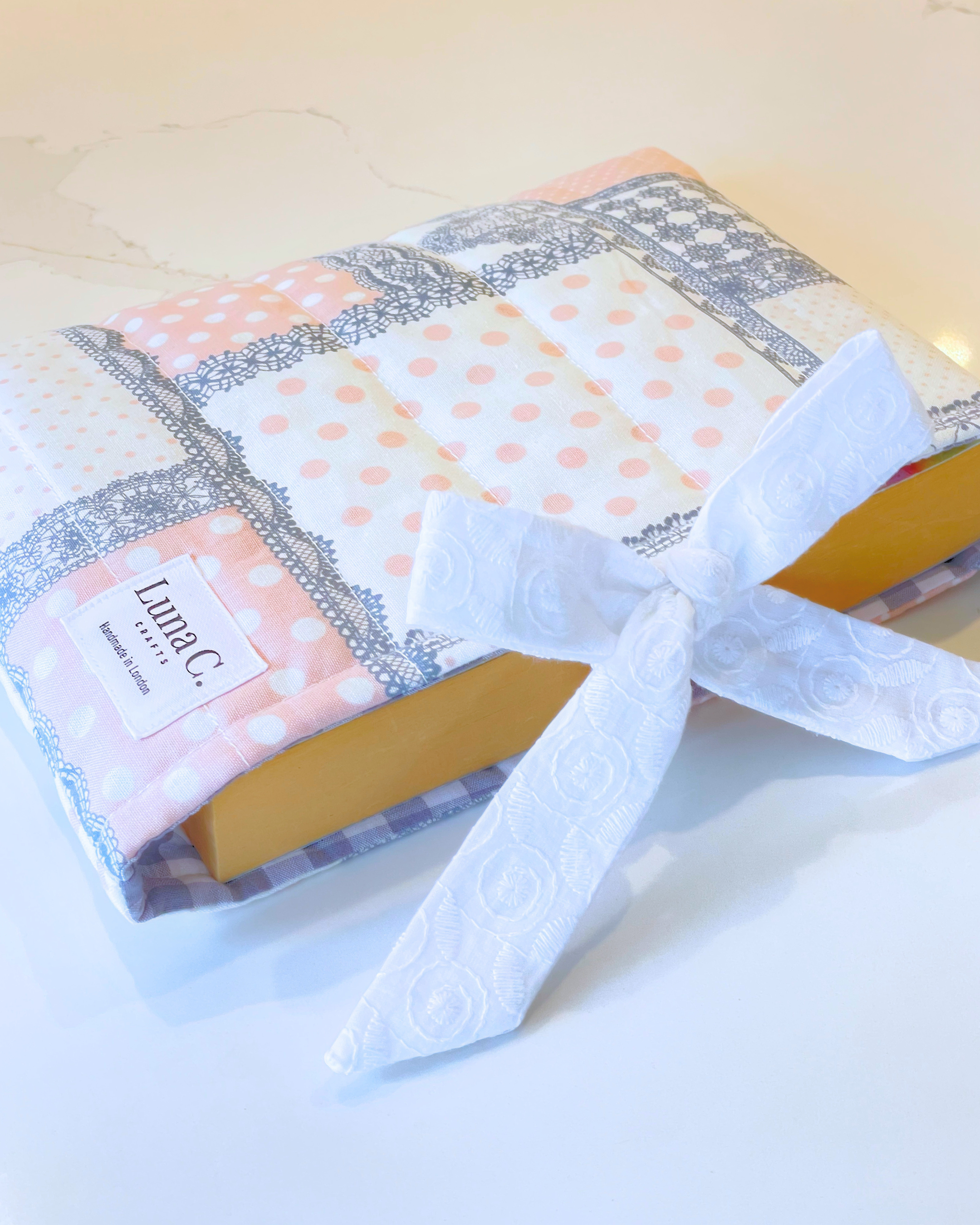 Pink and Grey Patchwork Book Sleeve with White Broderie Anglaise Ribbon Tie