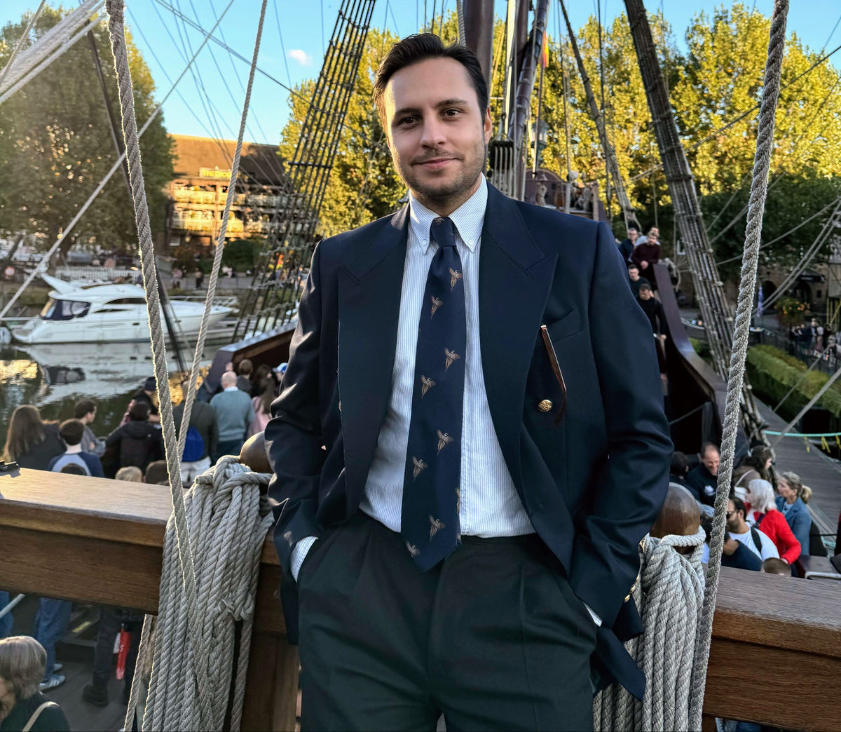 author alex mura standing on a ship