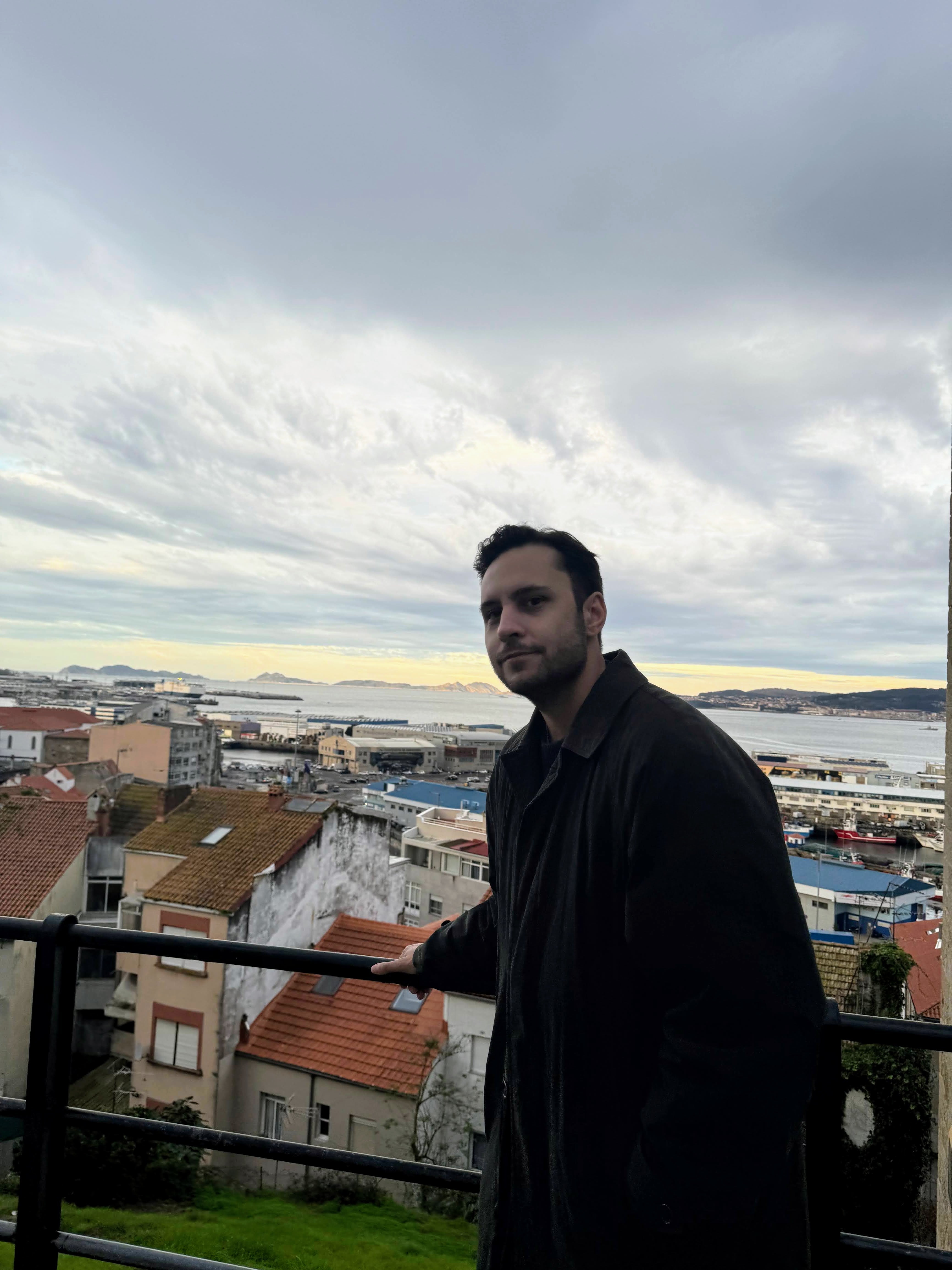 author alex mura standing at the top of a hill
