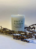 White glass Poet's Garden scented candle by HANABI CLUB, styled with dried lavender stems against a light background.