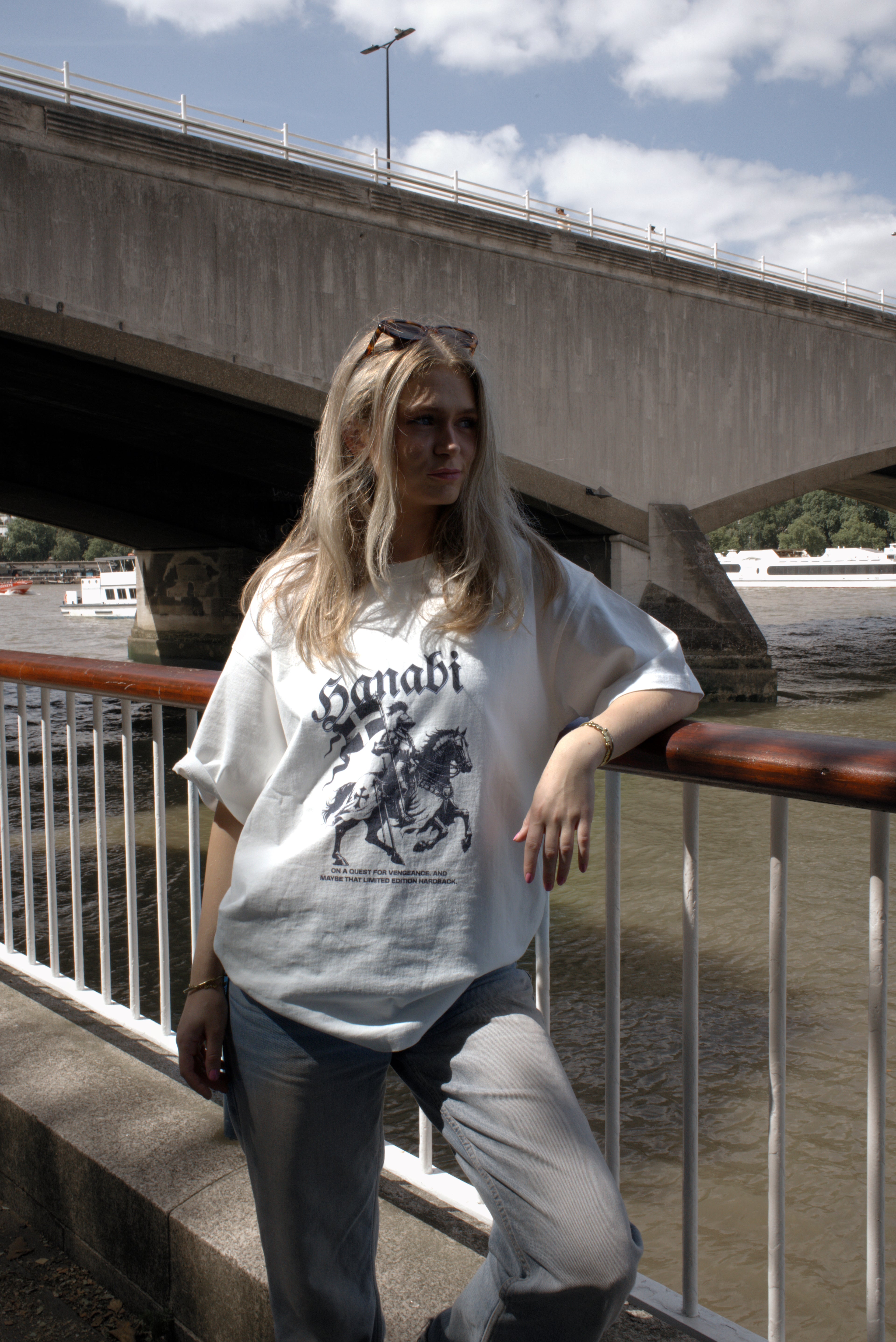 Woman wearing a Hanabi bookish graphic t-shirt