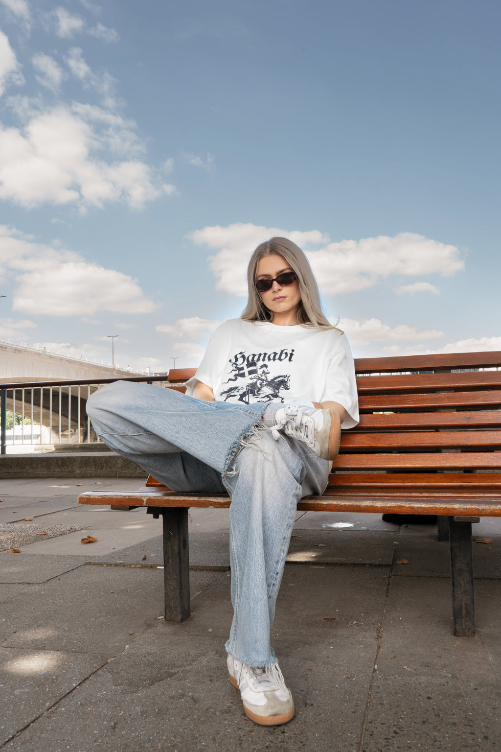 Woman wearing a Hanabi bookish graphic t-shirt