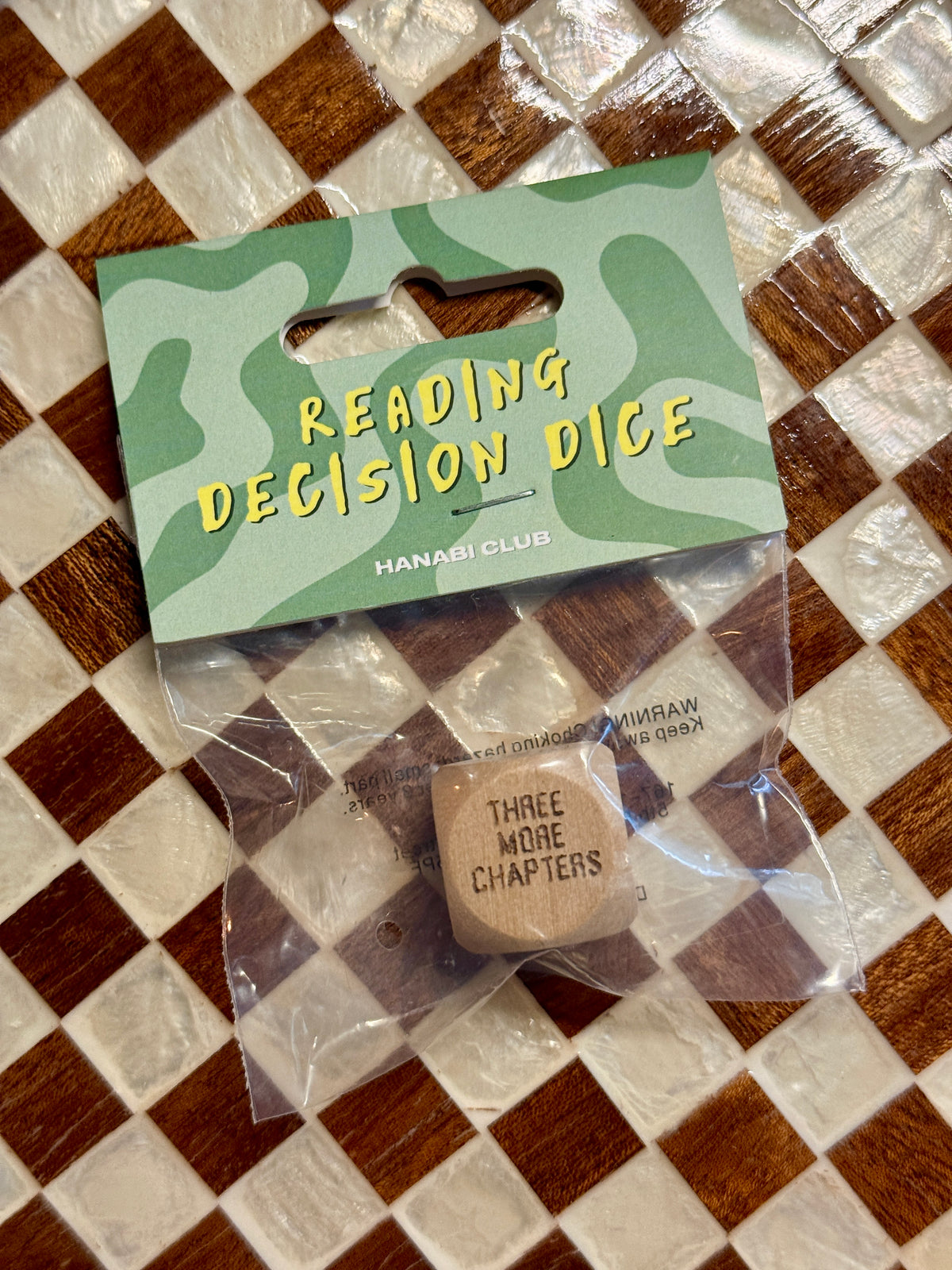 HANABI CLUB wooden Reading Decision Die in clear retail packaging with green camouflage header card.